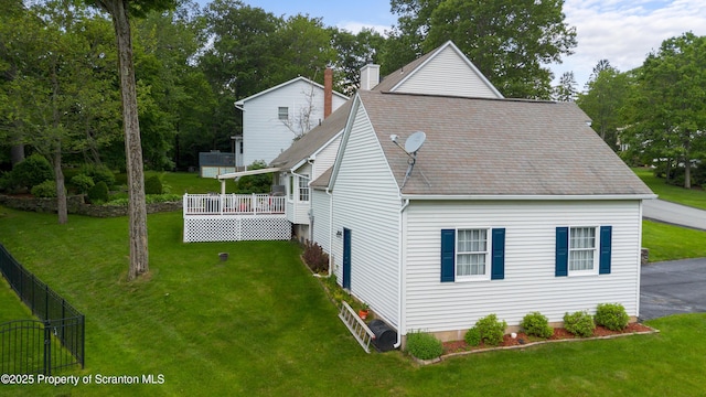 1200 Merion Cir, Clarks Summit, PA 18411 - view of side of property featuring a shingled roof and a wooden deck