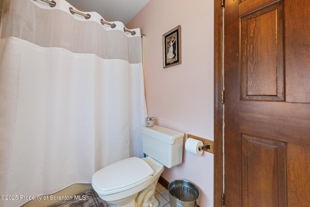 1200 Merion Cir, Clarks Summit, PA 18411 - bathroom featuring a shower with shower curtain and tile patterned flooring