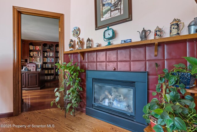 1200 Merion Cir, Clarks Summit, PA 18411 - detailed view of a tiled fireplace and wood finished floors
