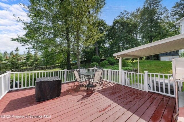 1200 Merion Cir, Clarks Summit, PA 18411 - wooden deck with a lawn, outdoor dining area, and view of wooded area