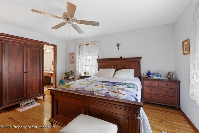 1200 Merion Cir, Clarks Summit, PA 18411 - bedroom with light wood-style flooring, a ceiling fan, and ensuite bath