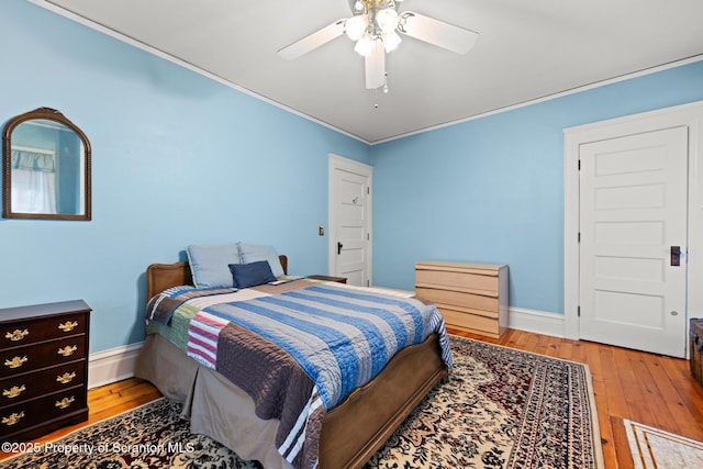 1012 Sunset St, Scranton, PA 18509 - bedroom with crown molding, wood-type flooring, a ceiling fan, and a baseboard radiator