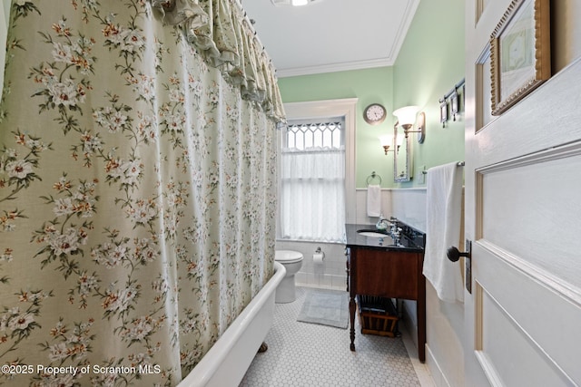 1012 Sunset St, Scranton, PA 18509 - bathroom with vanity, tile walls, crown molding, shower / bath combo, and wainscoting