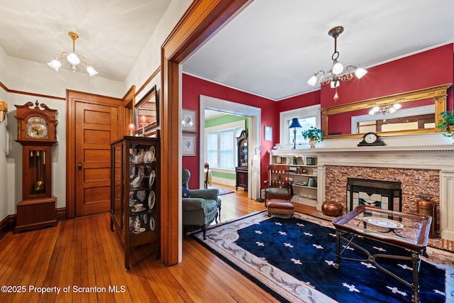 1012 Sunset St, Scranton, PA 18509 - living room with a chandelier, hardwood / wood-style flooring, and a high end fireplace