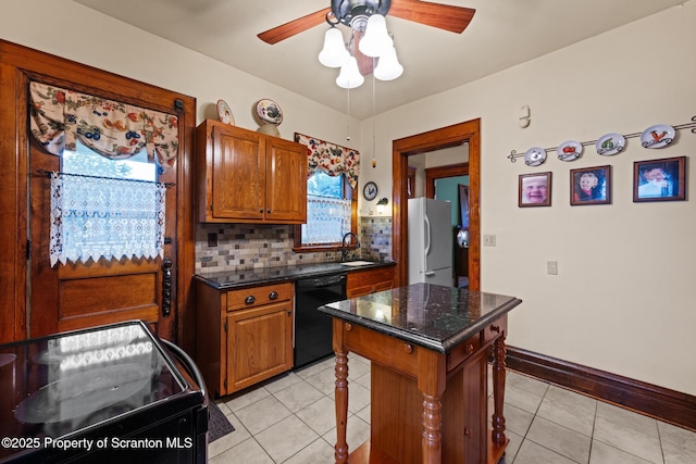 1012 Sunset St, Scranton, PA 18509 - kitchen featuring black appliances, plenty of natural light, a ceiling fan, and light tile patterned floors