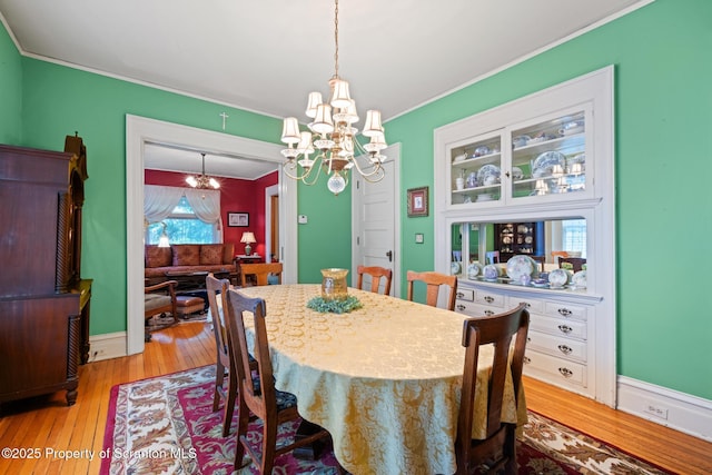1012 Sunset St, Scranton, PA 18509 - dining space featuring a chandelier, ornamental molding, and light wood finished floors