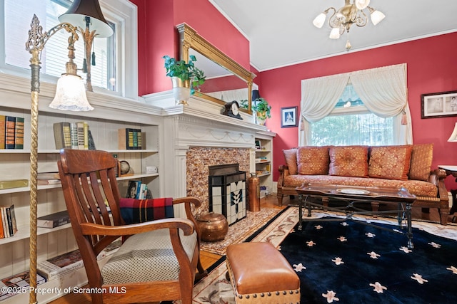 1012 Sunset St, Scranton, PA 18509 - living room featuring healthy amount of natural light, a high end fireplace, crown molding, and a chandelier