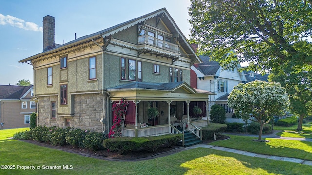 1012 Sunset St, Scranton, PA 18509 - view of front of property featuring a porch, a front lawn, a chimney, and stone siding