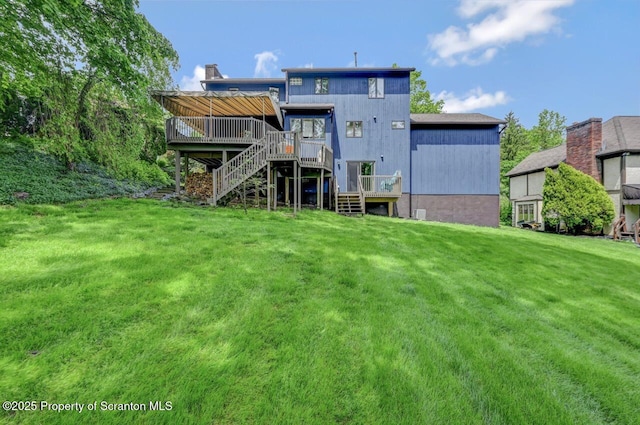 993 Oakmont Rd, Clarks Summit, PA 18411 - rear view of property featuring a wooden deck, stairway, and a lawn