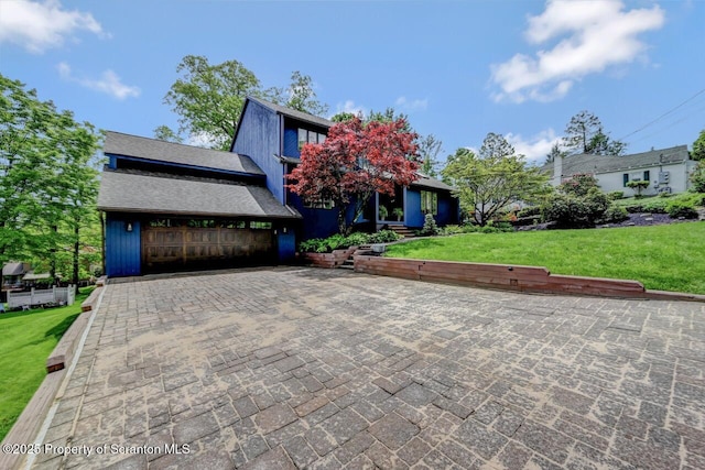 993 Oakmont Rd, Clarks Summit, PA 18411 - view of front of property with a garage, a front yard, driveway, and a shingled roof