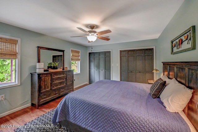 993 Oakmont Rd, Clarks Summit, PA 18411 - bedroom featuring multiple closets, baseboards, wood finished floors, and ceiling fan