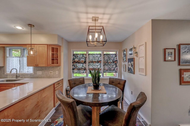 993 Oakmont Rd, Clarks Summit, PA 18411 - dining room featuring a chandelier, baseboards, dark wood-style flooring, and plenty of natural light