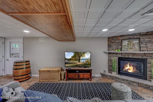 993 Oakmont Rd, Clarks Summit, PA 18411 - tiled living area with baseboards, recessed lighting, and a stone fireplace