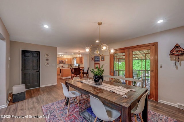 993 Oakmont Rd, Clarks Summit, PA 18411 - dining area with baseboards, wood finished floors, recessed lighting, and a chandelier