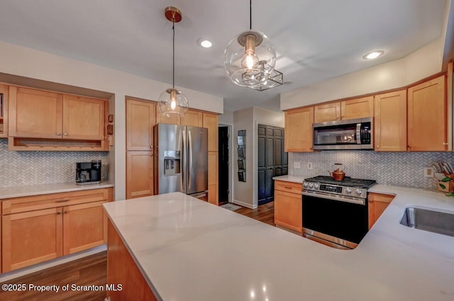 993 Oakmont Rd, Clarks Summit, PA 18411 - kitchen featuring stainless steel appliances, backsplash, light countertops, dark wood-style floors, and hanging light fixtures