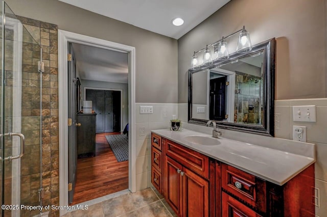 993 Oakmont Rd, Clarks Summit, PA 18411 - bathroom featuring vanity, a stall shower, and tile walls
