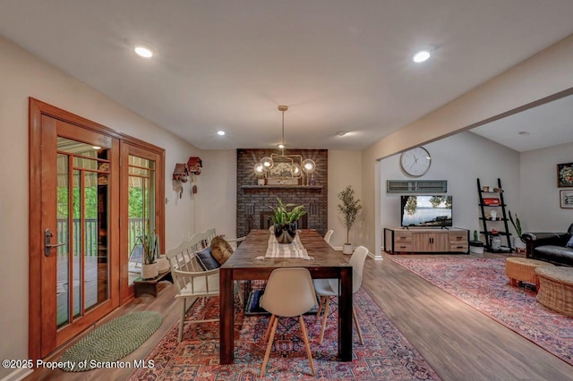 993 Oakmont Rd, Clarks Summit, PA 18411 - dining area with wood finished floors, a fireplace, and recessed lighting