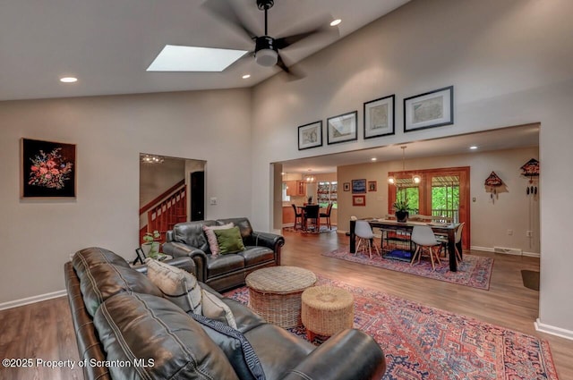 993 Oakmont Rd, Clarks Summit, PA 18411 - living area with a ceiling fan, wood finished floors, baseboards, recessed lighting, and a skylight