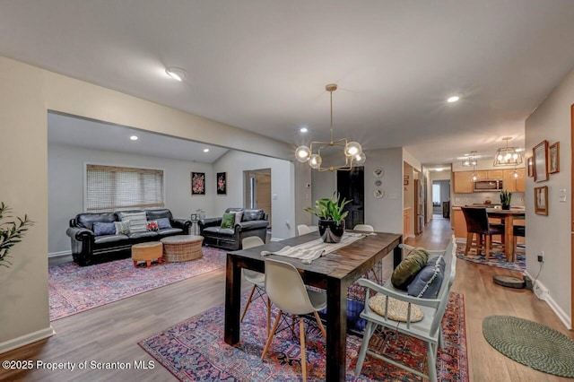 993 Oakmont Rd, Clarks Summit, PA 18411 - dining area with a chandelier, light wood-type flooring, baseboards, and recessed lighting