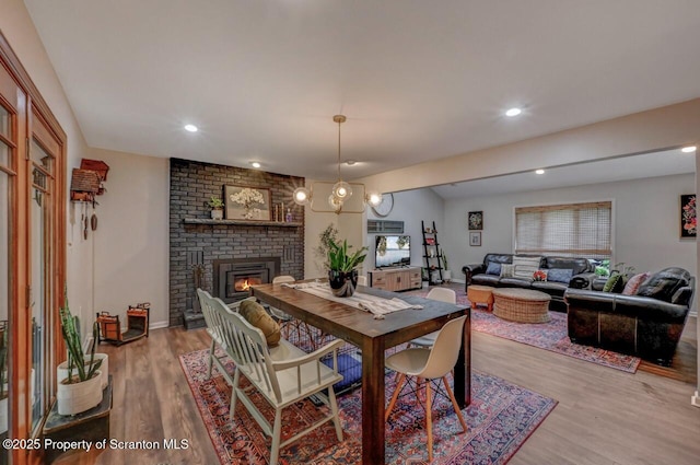 993 Oakmont Rd, Clarks Summit, PA 18411 - dining area featuring a brick fireplace, wood finished floors, and recessed lighting