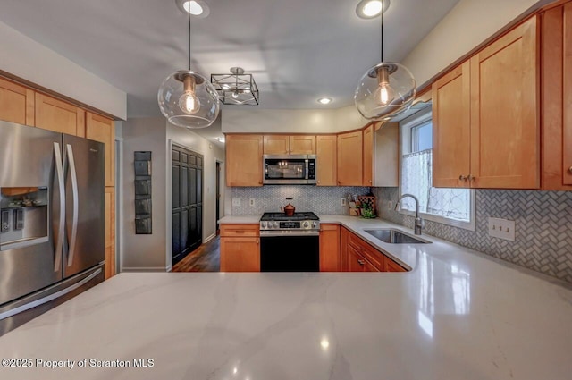 993 Oakmont Rd, Clarks Summit, PA 18411 - kitchen with appliances with stainless steel finishes, a sink, backsplash, pendant lighting, and recessed lighting