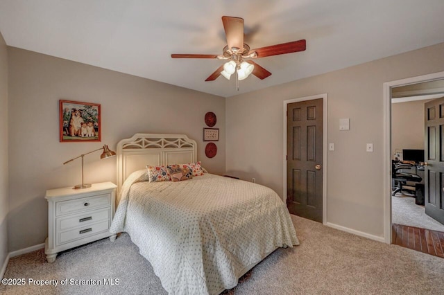 993 Oakmont Rd, Clarks Summit, PA 18411 - bedroom with light colored carpet, baseboards, and ceiling fan