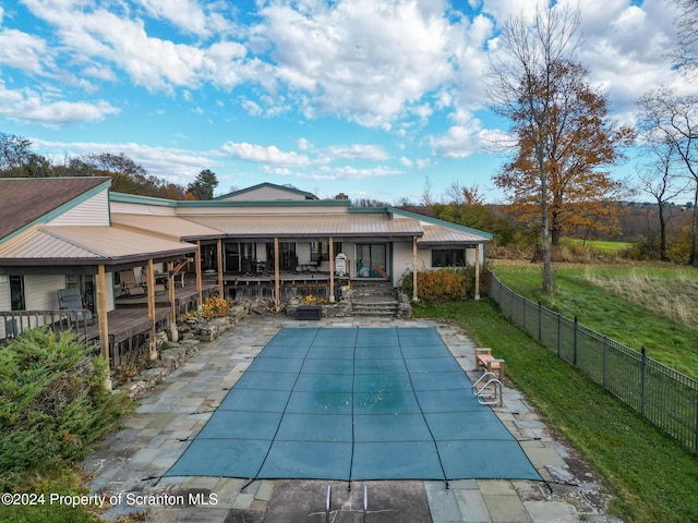 back of house with a patio area and a swimming pool side deck