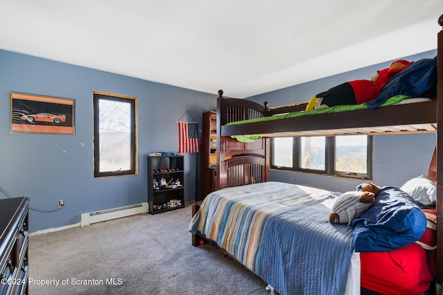 bedroom with light colored carpet and a baseboard heating unit