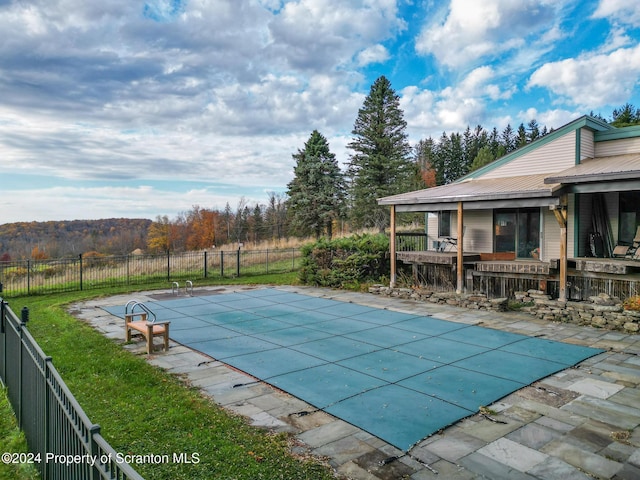 view of pool with a patio area