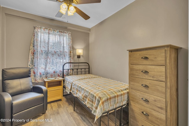 bedroom featuring light wood-type flooring and ceiling fan