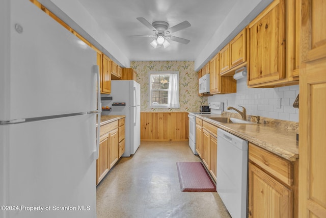 kitchen featuring ceiling fan, white appliances, and sink