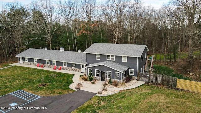 view of front of home with a front lawn