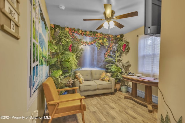 sitting room with ceiling fan and light hardwood / wood-style floors