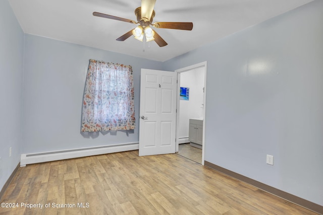 unfurnished room featuring a baseboard radiator, light hardwood / wood-style flooring, and ceiling fan