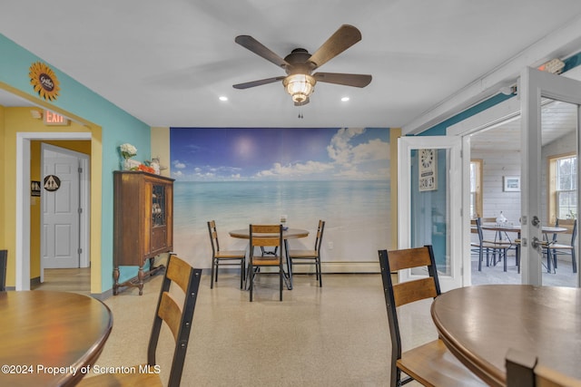 dining area with ceiling fan and french doors