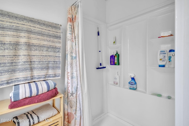 bathroom featuring a shower with curtain