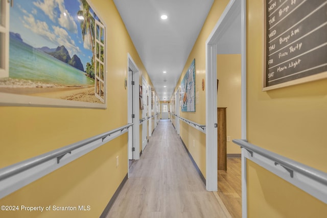 hallway featuring light hardwood / wood-style flooring