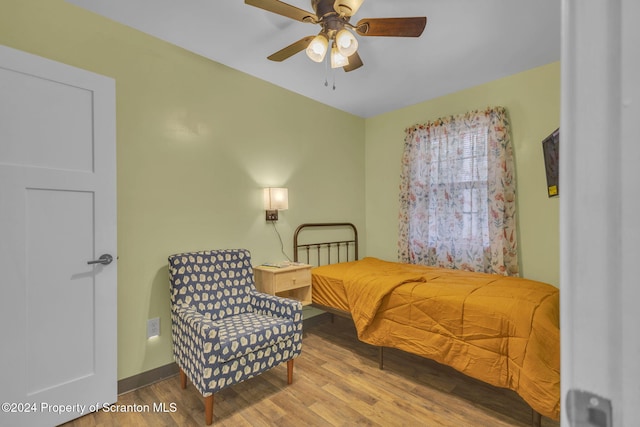 bedroom featuring ceiling fan and hardwood / wood-style flooring