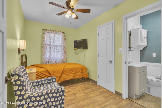 sitting room with ceiling fan and light hardwood / wood-style floors