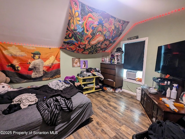 730732 Minooka Ave, Moosic, PA 18507 - bedroom featuring wood finished floors, lofted ceiling, and cooling unit