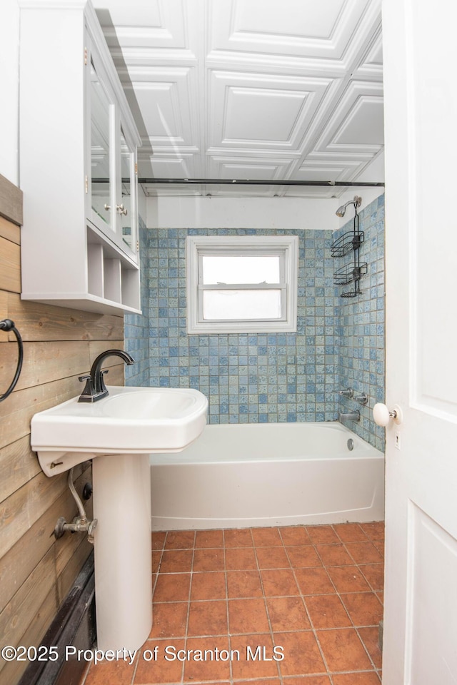 full bathroom featuring an ornate ceiling, tile patterned flooring, and washtub / shower combination