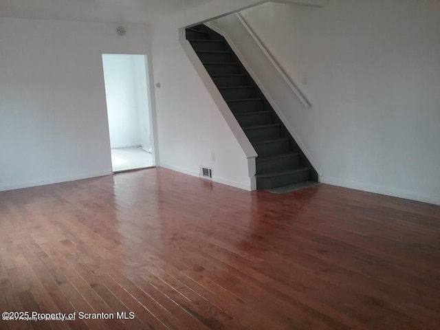 unfurnished room with dark hardwood / wood-style floors