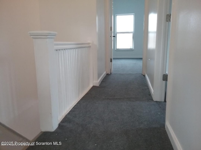 hall with dark carpet