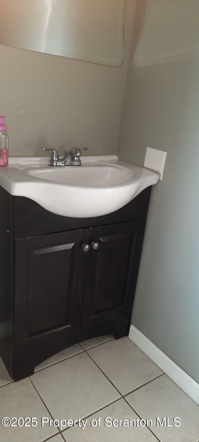bathroom with vanity and tile patterned floors