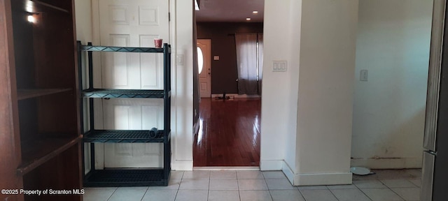hallway featuring light tile patterned floors