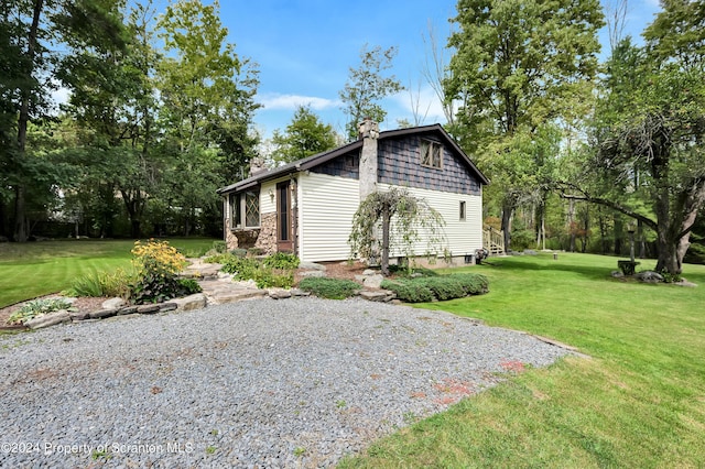 view of property exterior featuring a lawn