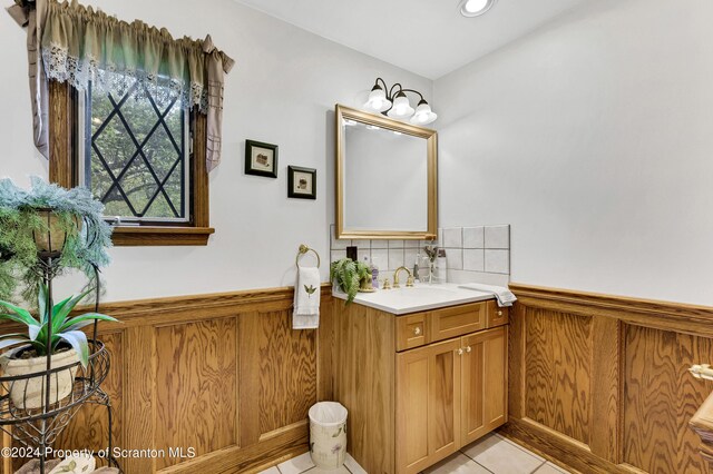 bathroom with tile patterned flooring and vanity