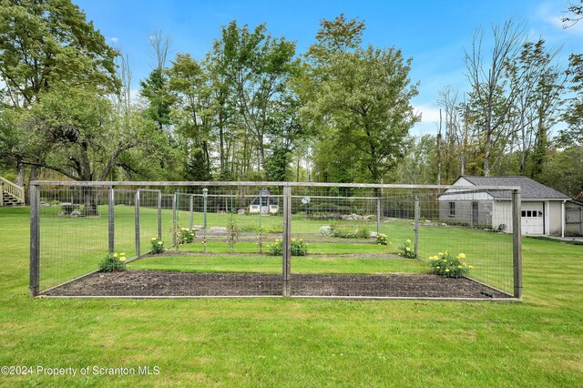 surrounding community featuring an outbuilding and a yard