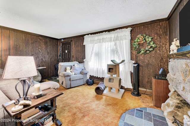 carpeted living room featuring wood walls