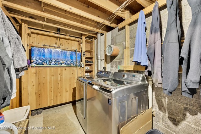 clothes washing area with washing machine and clothes dryer